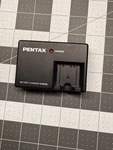 Pentax D-BC63 Oem Battery Charger Without Power Cable. Fixed Price $9.99.