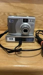 Hewlett Packard Photosmart 3.2 Mp Digital Camera Model 735 & Dock Transfer Base. Fixed Price $25.00.
