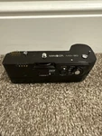 Minolta MD-90 Motor Drive With NP-90M Battery Untested. Fixed Price $29.99.