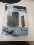 2C7- Vivitar Universal Battery Charger Black Open Box With New Product. Fixed Price $20.79.